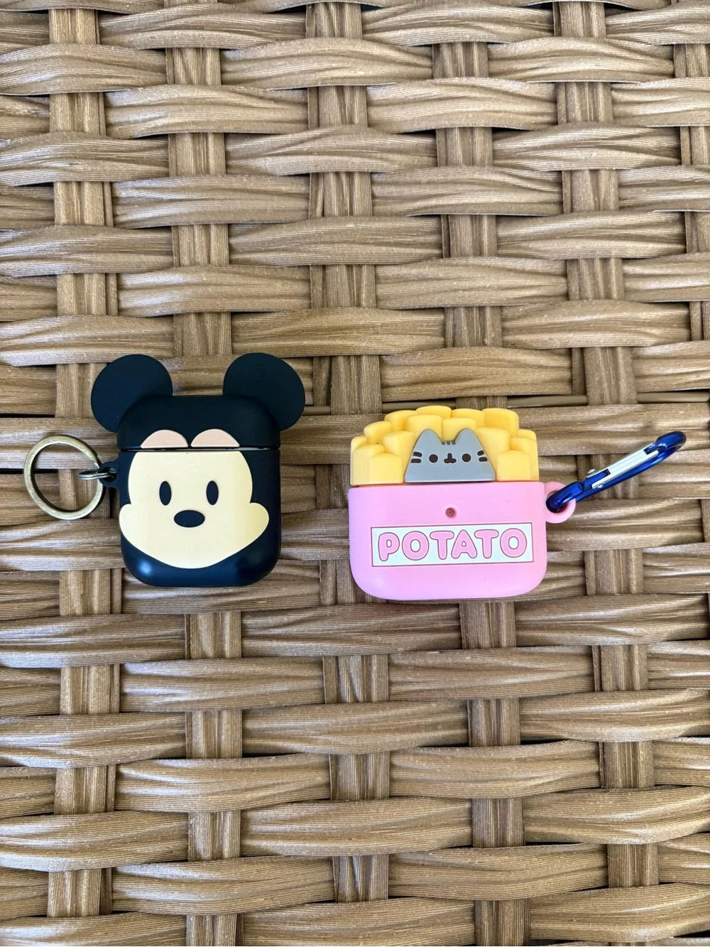 2 Apple AirPods with cases